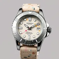 A stylish submarine-style watch design inspired by the artistic aesthetics of Maison Margiela footwear, featuring a unique paint splatter effect on the watch face