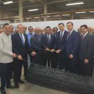 H&M Electric forming a significant partnership with KEI Industries, a preeminent wire/cable manufacturer in India, surrounded by a backdrop of various electrical wires and related products
