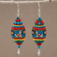Earrings featuring Peruvian Andean themes, incorporating typical elements such as llamas, Incan icons, and vibrant colors inspired by traditional textiles.