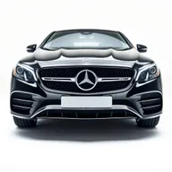 A striking black Mercedes CLE showcased from the front perspective, highlighting its luxurious grille, iconic Mercedes logo, and elegant headlights against a completely white background