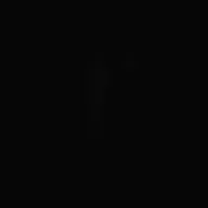 A striking dark black background showcasing the gentle light shadow of a man
