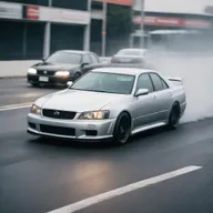 A dynamic image of a Toyota Chaser in a heated street race against a Nissan Skyline V35, with both cars speeding on an open road.