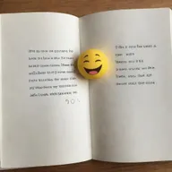 An open book with a love quote on one side, accompanied by a kissing emoji. The other page remains blank.